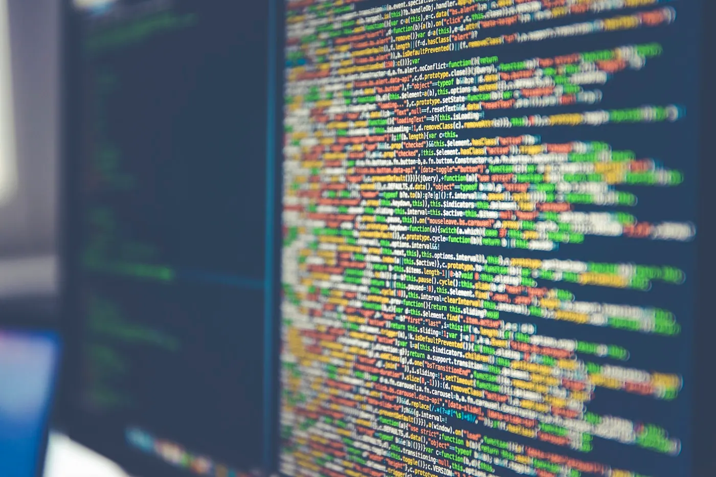 Colorful lines of source code on a dark screen