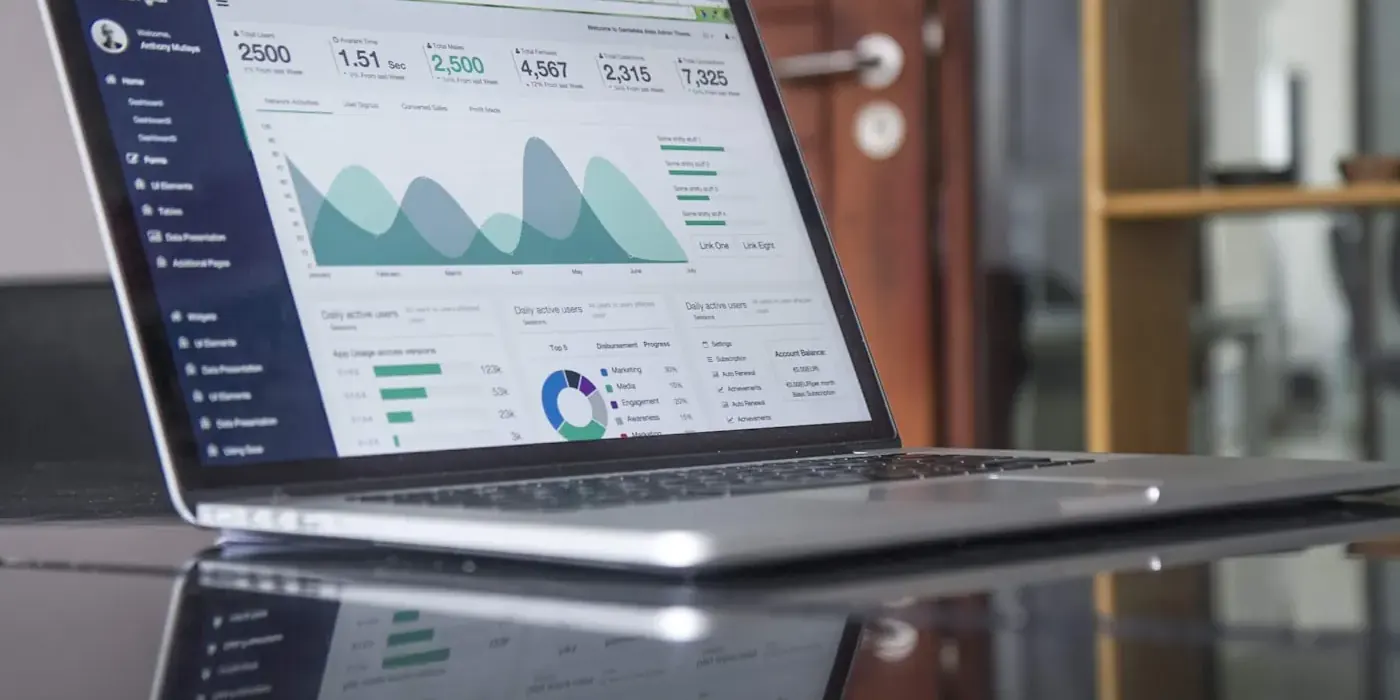 Data charts and graphs displayed on a laptop