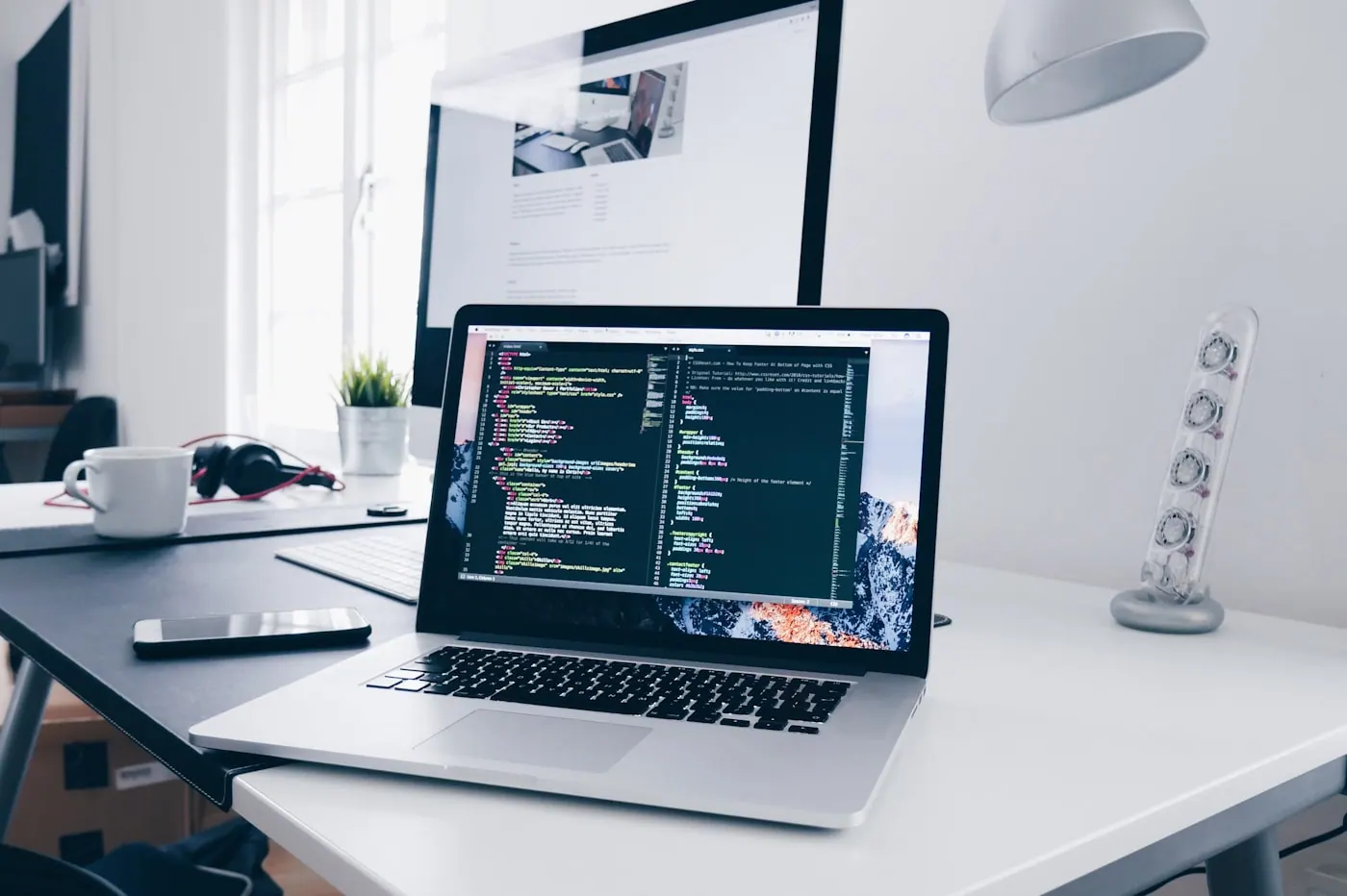 Software engineer writing code on a laptop